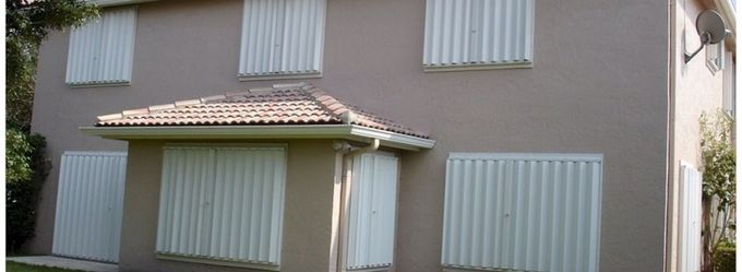 Hurricane shutter assistance