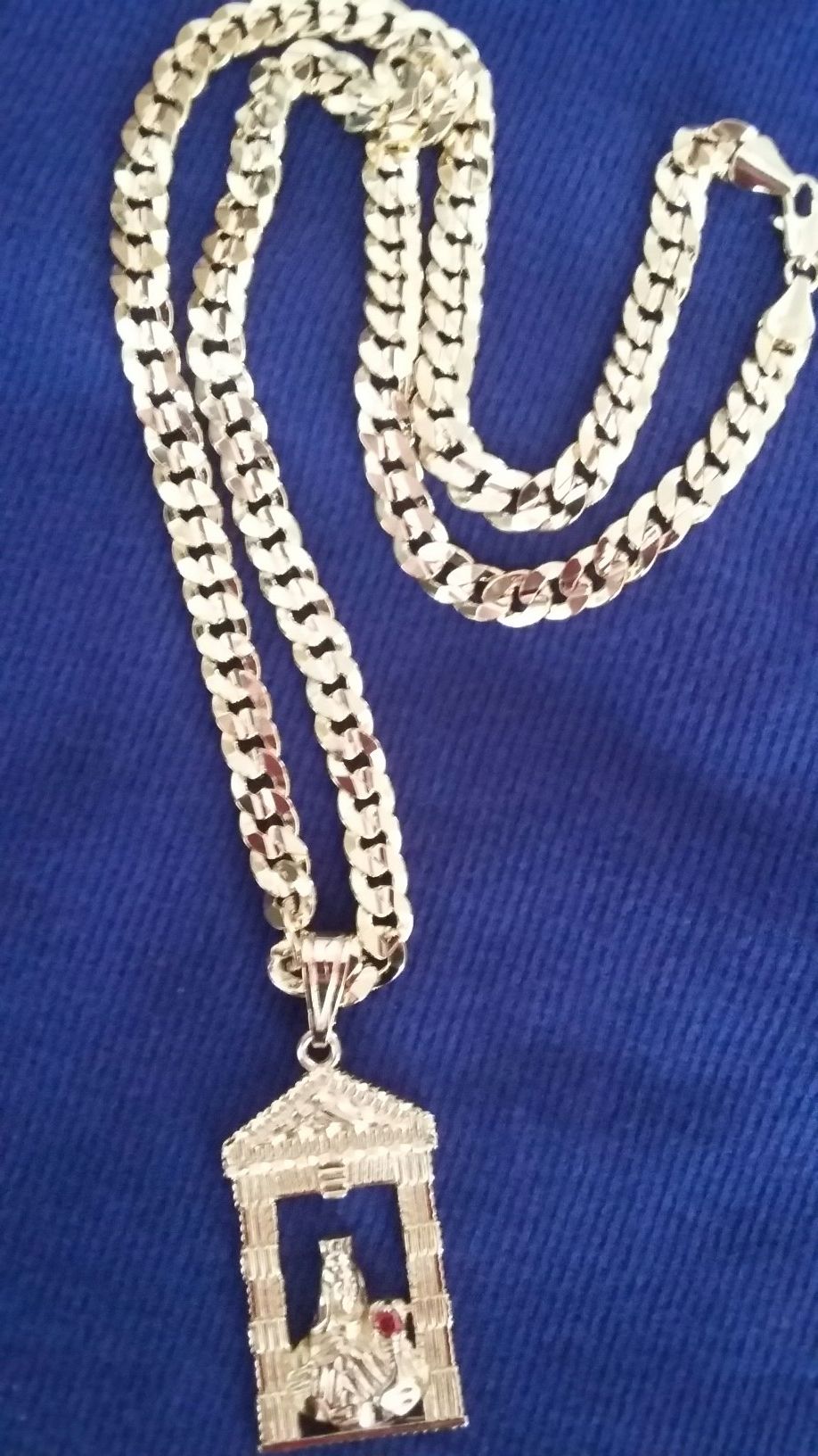 Very nice 14kt gold over stainless steel 26inch Cuban link Chain with nice Santa Barbara charm for sale !!