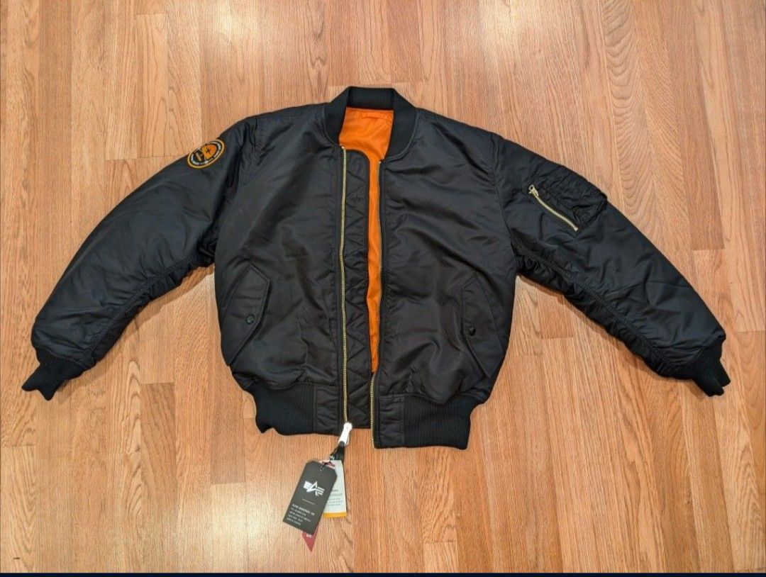 Alpha Industries MA-1 Flight Jacket. Reversible: Black/Bright orange.
Size: Medium.