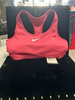 pink Nike Swoosh sports bra features a racerback design for support and comfort