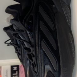Women’s black Adidas size 7 1/2 used one time only In brand new condition
