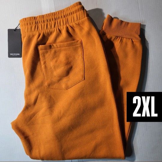 true religion bright orange joggers