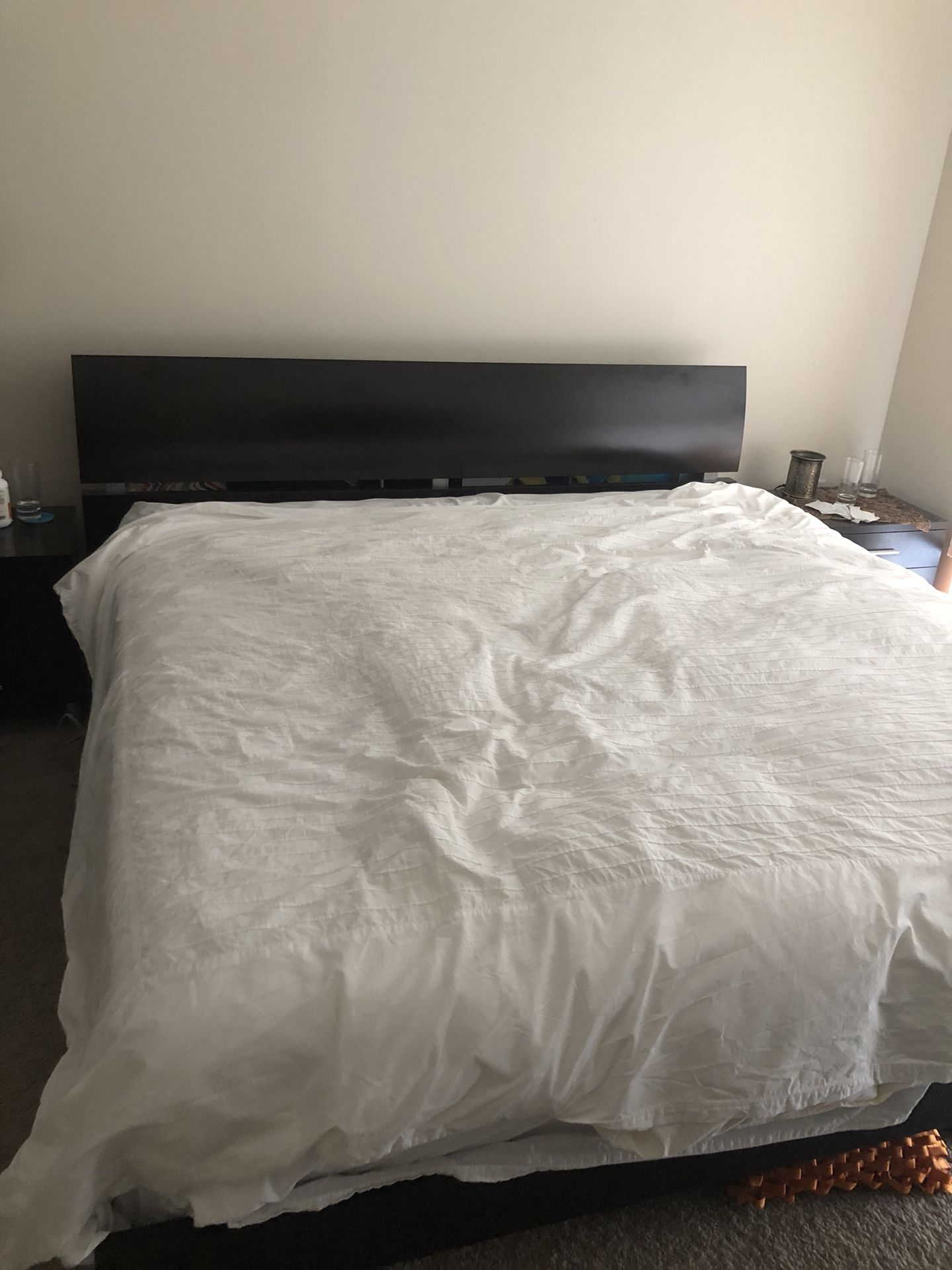 Dark brown bed frame and mattress