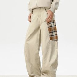 Check-patterned pocketed quilted utility pants for men, featuring a curved knife design. This is a new spring 2025 style from a trendy brand, featurin