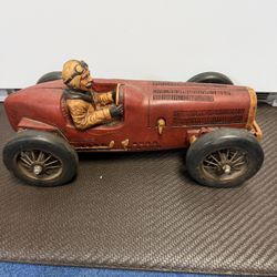 Vintage Bugatti model race car is a collectible sculpture of a 1920s racing sport car constructed from resin, Design: Features a detailed driver figur