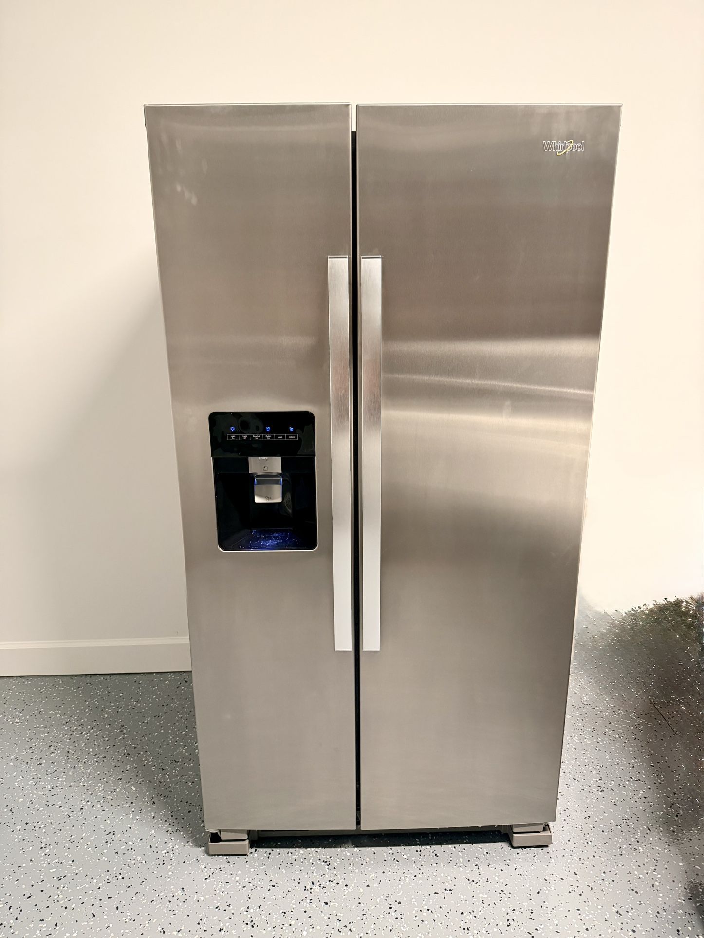 New 33” standard depth Whirlpool side by side stainless steel refrigerator for sale!