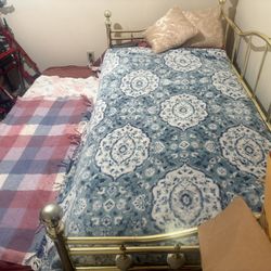 Vintage Style Victorian Brass Trundle Twin Bed With Floral Ceramic Balls On Sides Of Main Bed   