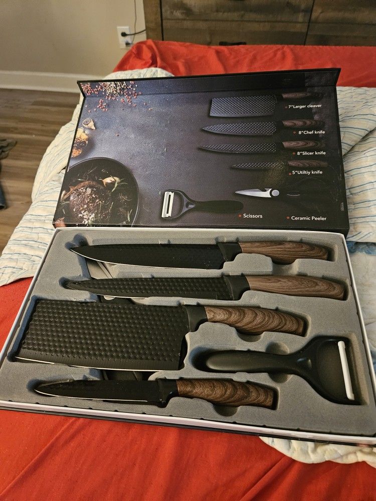 Variety Of Kitchen Knives And Filet And Camping Knives.