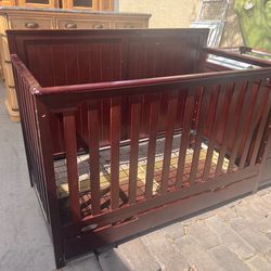 Baby crib with drawers