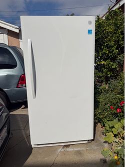 Upright freezer in excellent condition by Kenmore with energy star   34” wide 28” side  66” tall