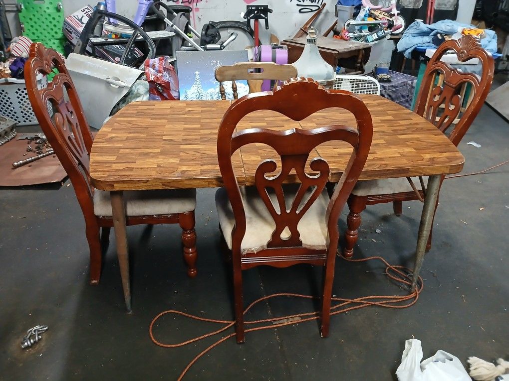Large table one leaf inside 4 chairs. $45