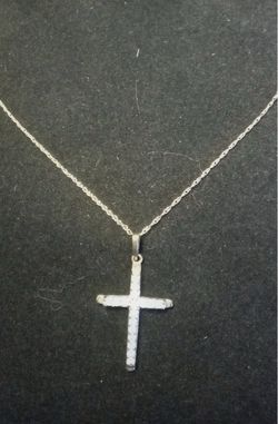 10k NC. Gold cross necklace with diamonds