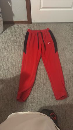 Red Nike fleece pants