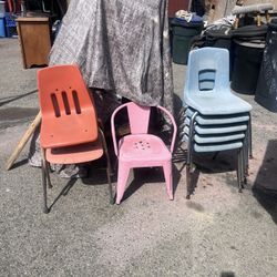 mix of used school-style chairs (plastic with metal legs) plus a small kids metal chair. Condition is fair—