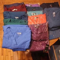 A LARGE BUNDLE OF PLUS SIZE SCRUBS.