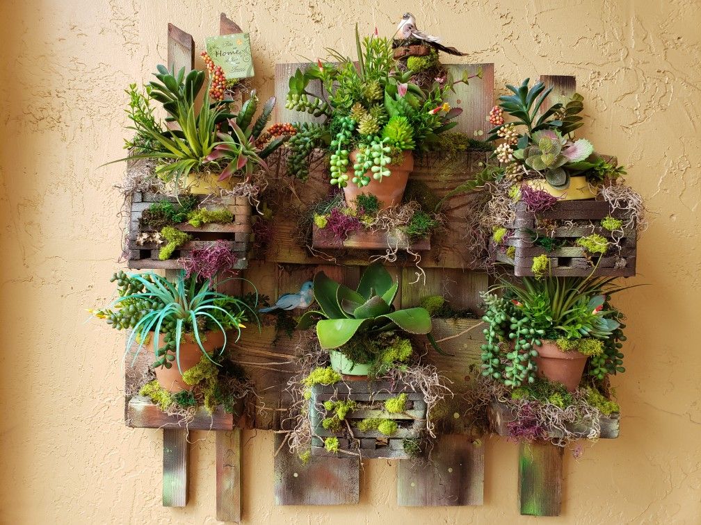 Succulent wall arrangement. One of a kind home made arrangement for your patio or front porch. Artificial plants.