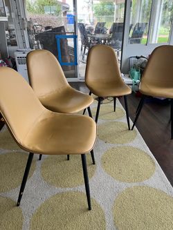 Set of 6 Tan Faux Leather Dining Chairs , 4th chair is free has some some kids paint