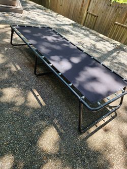Black folding cot