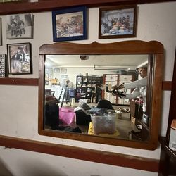 mirror, with its wooden trim