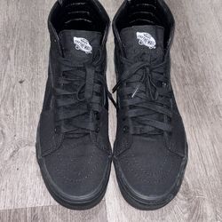 Black high top Vans shoes