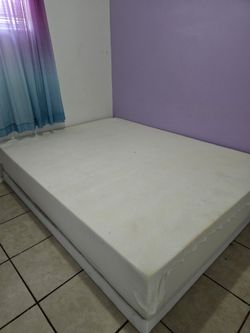 Queen size bed with metal Box spring.