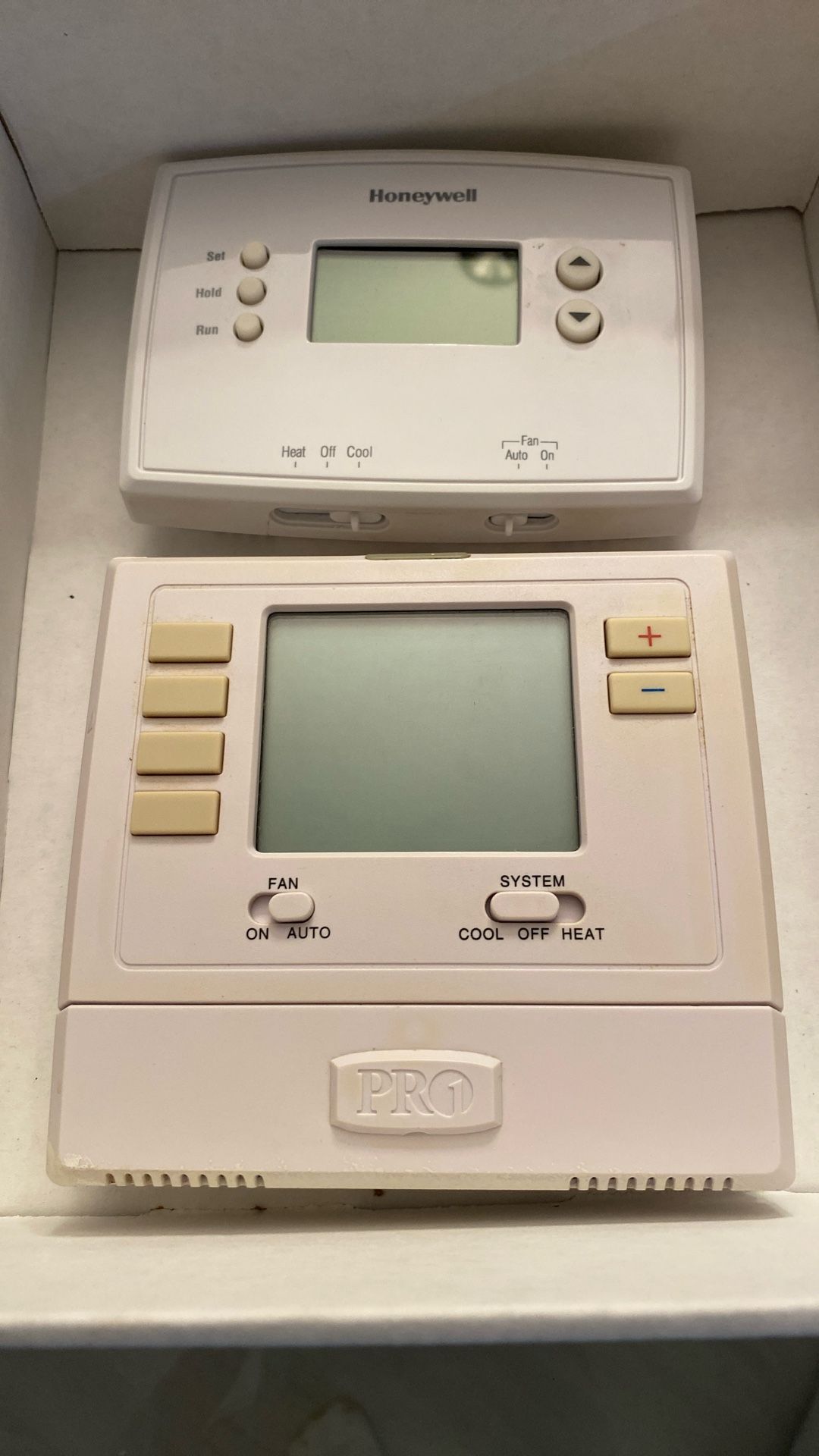 Two A/C Thermostats Honeywell And Pro1