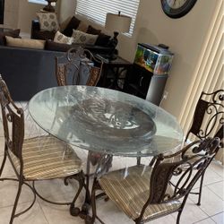 Round Dining table with four chairs in the carpet