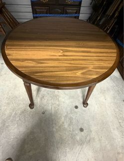 Vintage dark wood dining table with two extending leaves and six matching chairs