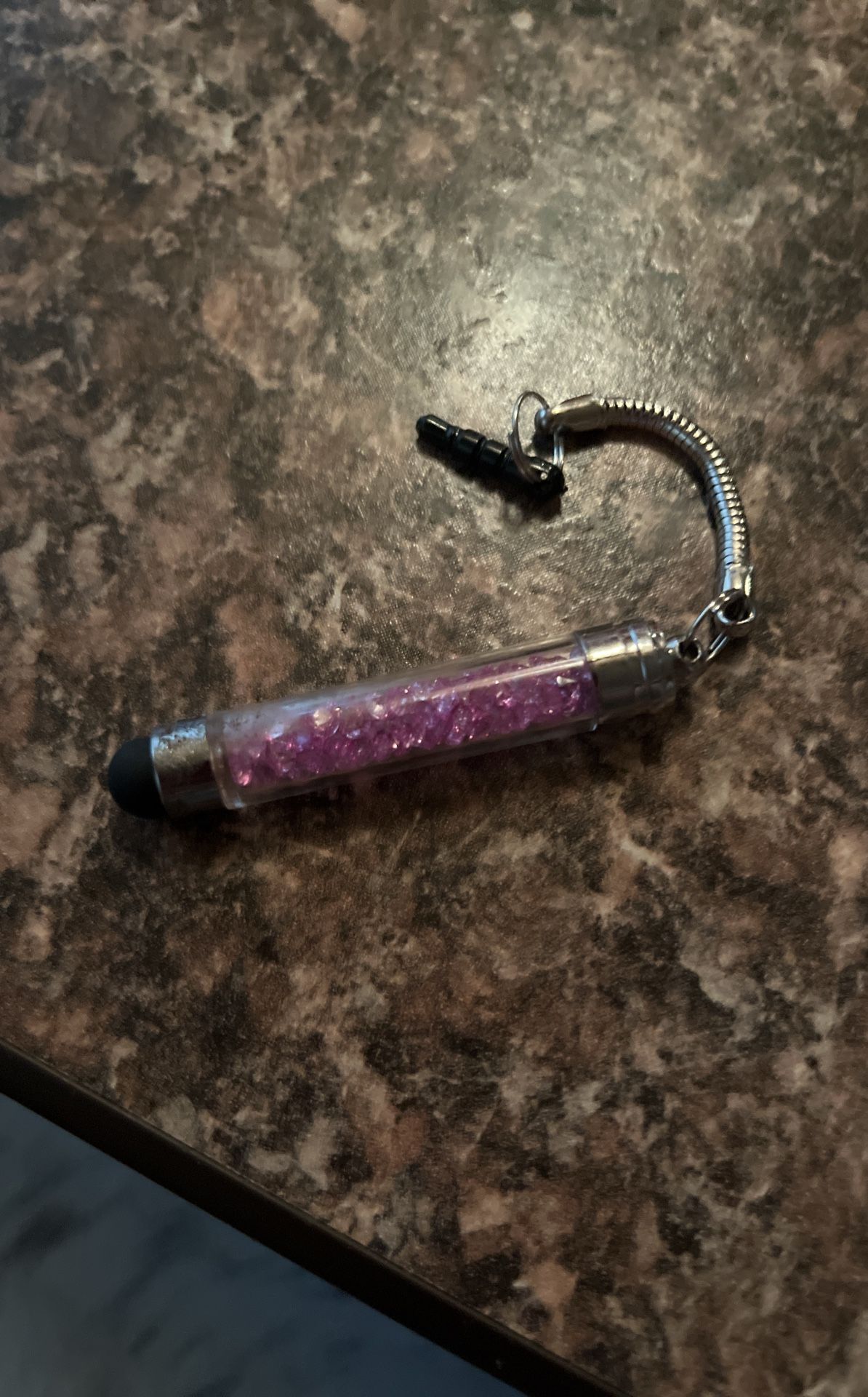 A phone pen with purple diamonds in it fake
