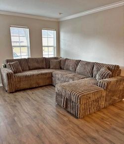 Chocolate Fabric Sectional with Pull-Out Bed and Storage Chaise. Brand New .