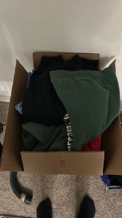 2 boxes full of large and Extra large sweaters and hoodies.
