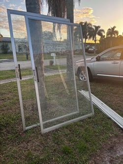 Pair Of Glass Sliding Doors With Track 48”Lx 79”H