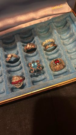 Green ring box, including nine Sterling silver rings