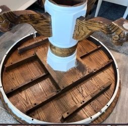 Round wood table with claw feet.