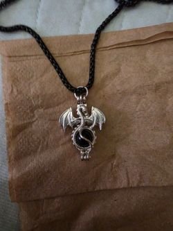 Dragon with pearl chain