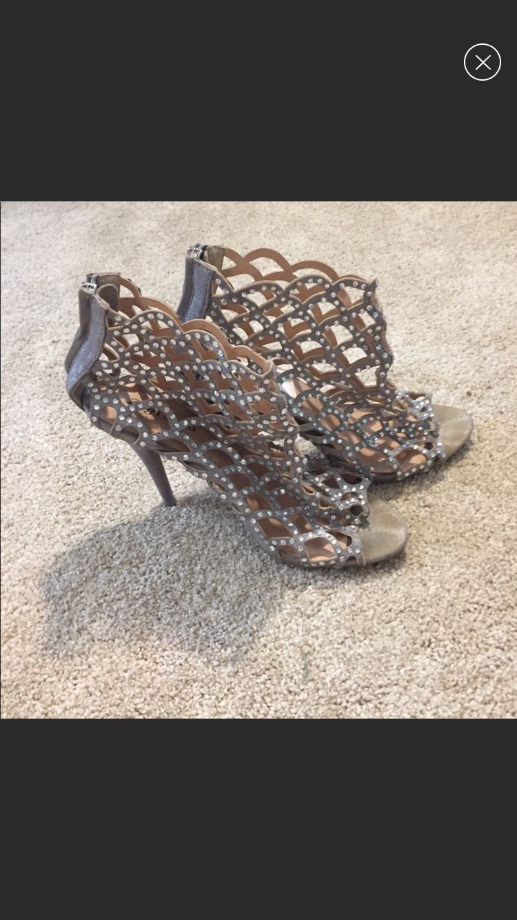 Size 9 Zigisoho silver studded four inch heels