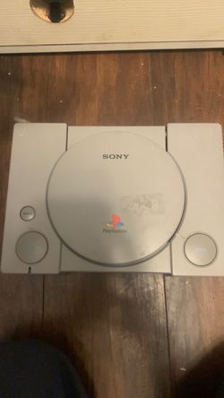 PlayStation 1, with controllers and power source