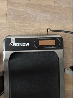 Mid size treadmill with remote control and suction cups for your phone.