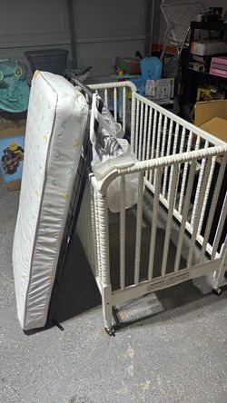 white crib with brand new mattress
