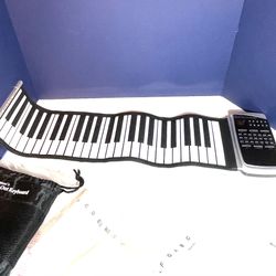 Giovanni’s Roll Out Piano And Microphone 
