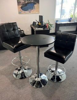 Pub height table with 2 adjustable vinyl black chairs