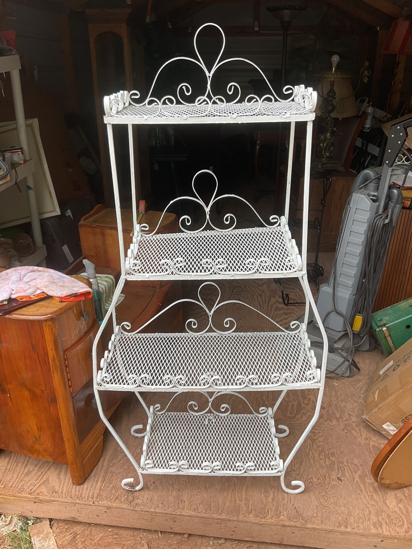 A metal shelf it’s 57 inches tall 26 inches wide and 11 inch’s deep