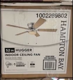 New Hampton Bay Hugger indoor ceiling fan. Fan is 52 inches and has a brushed nickel finish. New