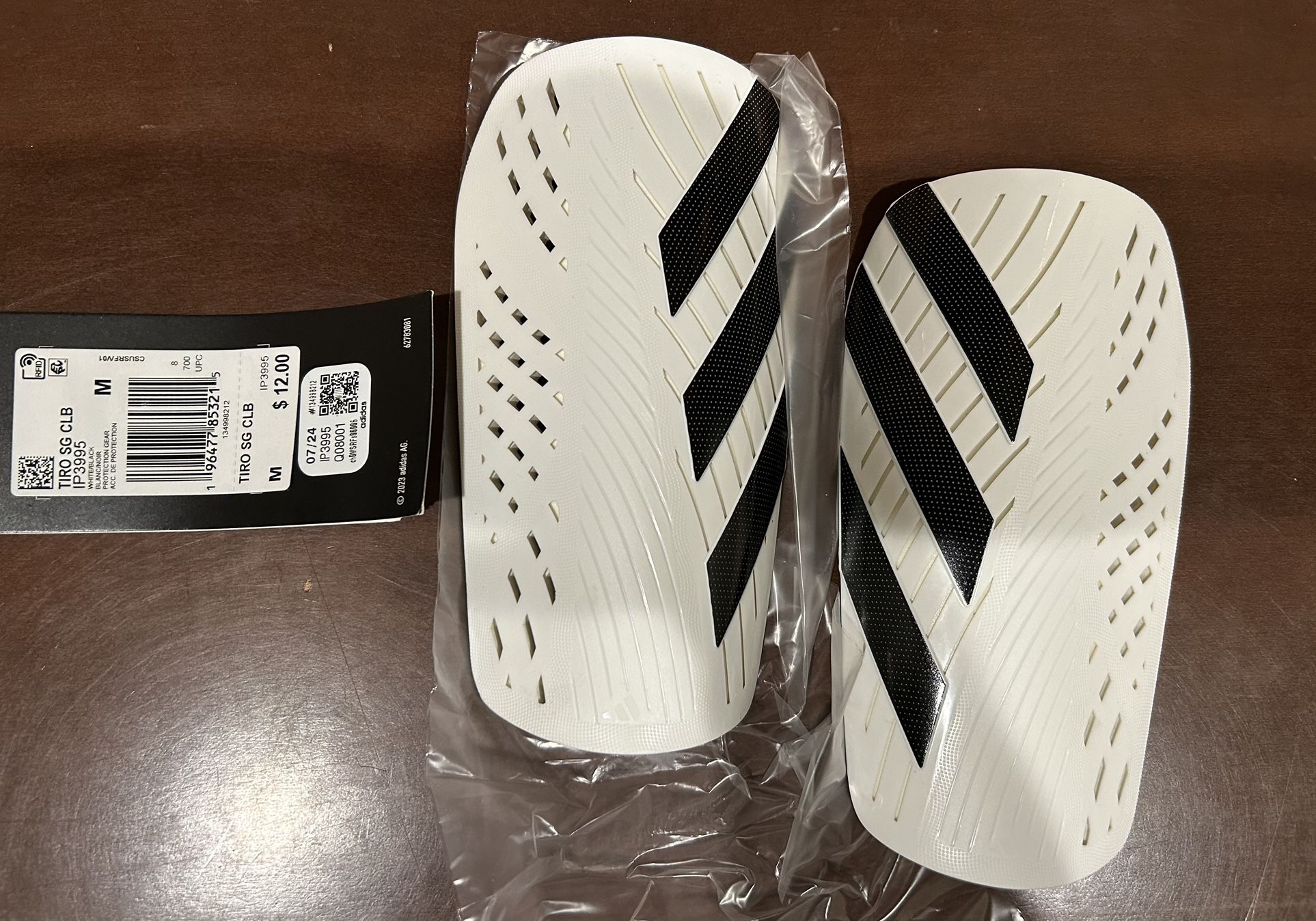 BRAND NEW ADIDAS soccer shin guards (size MED)