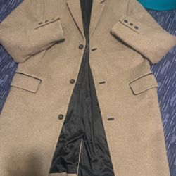 TOP. MAN  Stylist  Dress Coat Slim Fit Size LG beige with leather trim on pockets And Button Trim