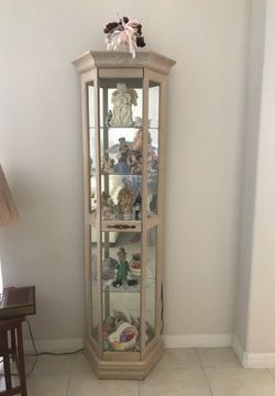 Curio cabinet with 4 glass shelves and bottom shelf