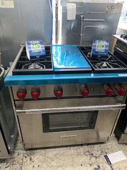 Wolf 36” slide in range with middle grill in stainless steel