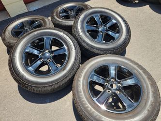 17" Jeep Wrangler black factory wheels and tires