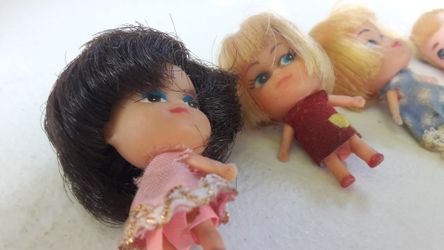 4 dolls and 1 head old style