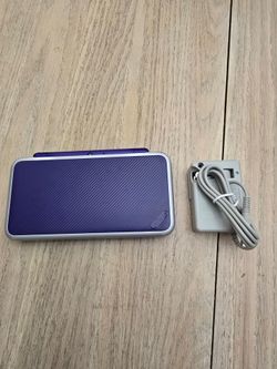 'New' Nintendo 2DS XL + 128GB microSD Card – $290